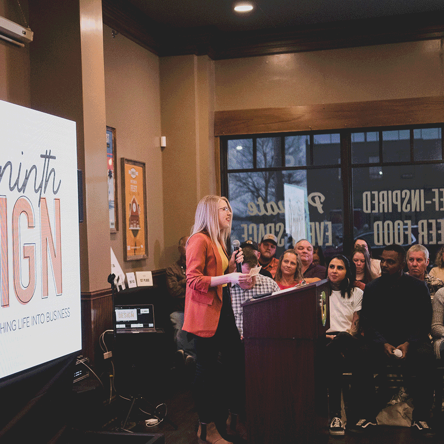 Gif of Hayley, owner of 29th Design, presenting and winning a business pitch competition..